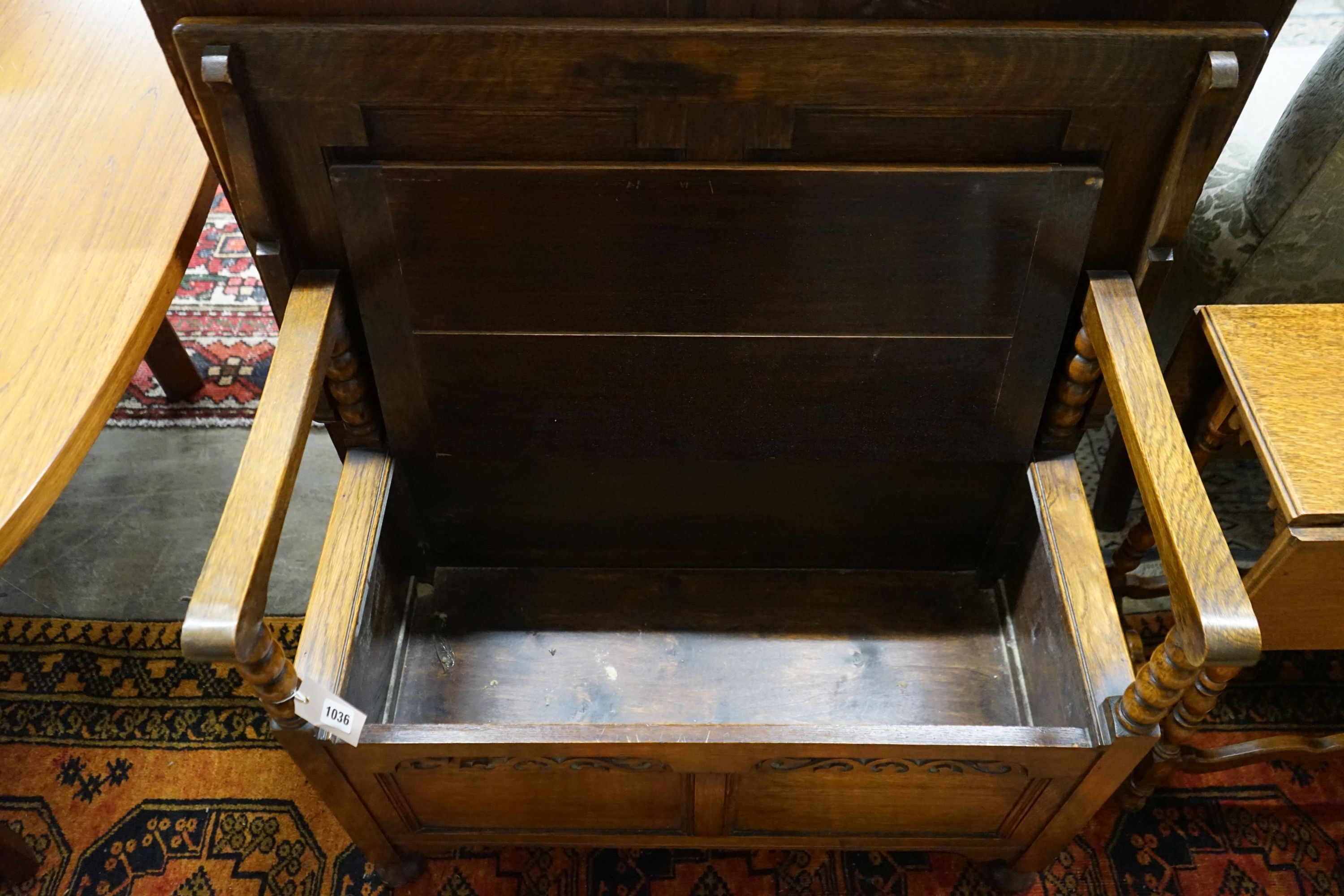 An oak monk's bench with folding top and locker seat, length 91cm, depth 47cm, height 92cm